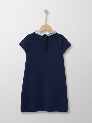 This 100% cotton Navy knit dress is adorned with an elegant collar in Liberty floral fabric. This classic Parisian dress is ideal for special occasions and every day chic wear alike.