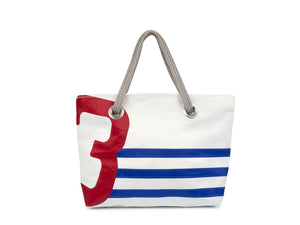 White with blue stripes and an over sized red number, this women's carry bag is made from 100% recycled sails. 