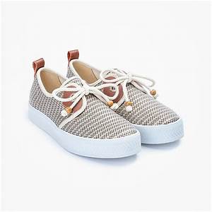 Women's lace-up platform sneakers from France, with 3cm-platform soles and canvas upper in gold stripes, with nautical style rope shoelaces with wood aglets, gold eyelets, and brown leather yokes. 