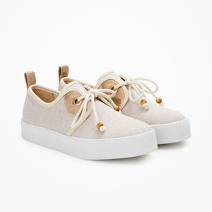 Women's lace-up platform sneakers from France, with 3cm-platform soles and canvas upper in sand stripes, with nautical style rope shoelaces with wood aglets, gold eyelets, and brown leather yokes. 