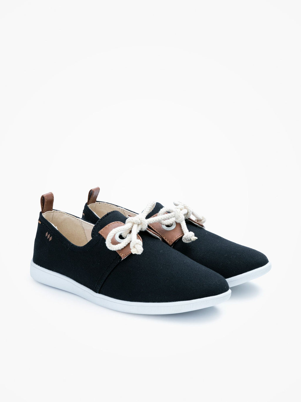 This minimalist black canvas sneaker is packed with neo-retro style and nautical inspiration with details such as oversized eyelets, leather yokes and marine-inspired cord laces.