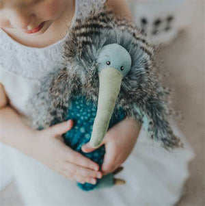 This super soft Kiwi bird sits squarely on his thick black and grey feather plumage. He boasts a long, corduroy green beak, a soft body of floral blue and green, with corduroy green feet and dark grey claws.