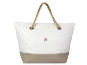 A stylish women's day bag made from recycled sails, linen and leather. Colours are camel and natural linen. It is sized for a day at the beach or a weekend getaway. 