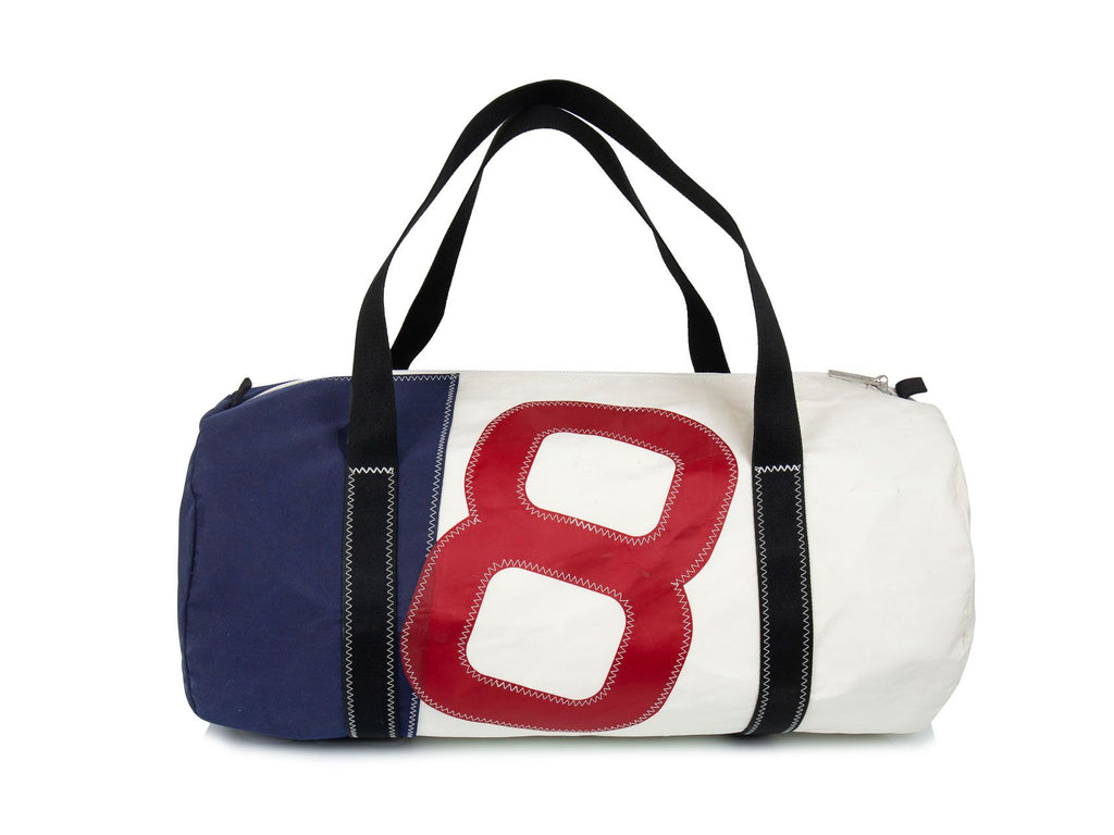 Stylish men's travel bag made in recycled sailcloth. White and blue sail, with oversized red number. Very resistant and perfect size for weekend getaways and short breaks. 